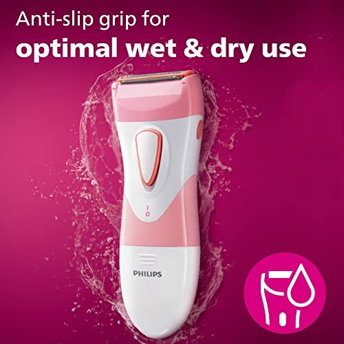 Pink Philips shaver with water splashes, anti-slip grip for wet and dry use.